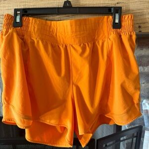 Lululemon size 12 orange shorts 6”